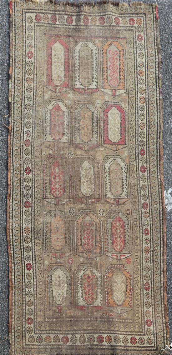 A Talish multi-coloured rug, c.1840, 7ft 2in by 3ft 3in.
